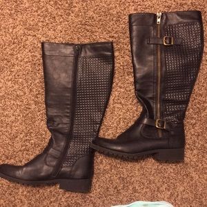 Black leather boots with gold buckle and gold zip